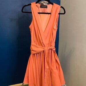 Akira peach colored v cut wrap dress